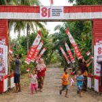 Villagers_decorating_archway_for_202608031614-2545470317